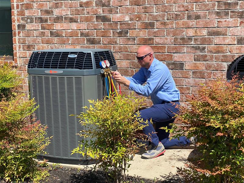 Technician Working on the Outdoor HVAC unit