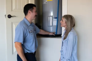 Paschal Plumber Working on Tankless Water Heater