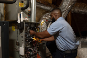Technician performing an HVAC repair