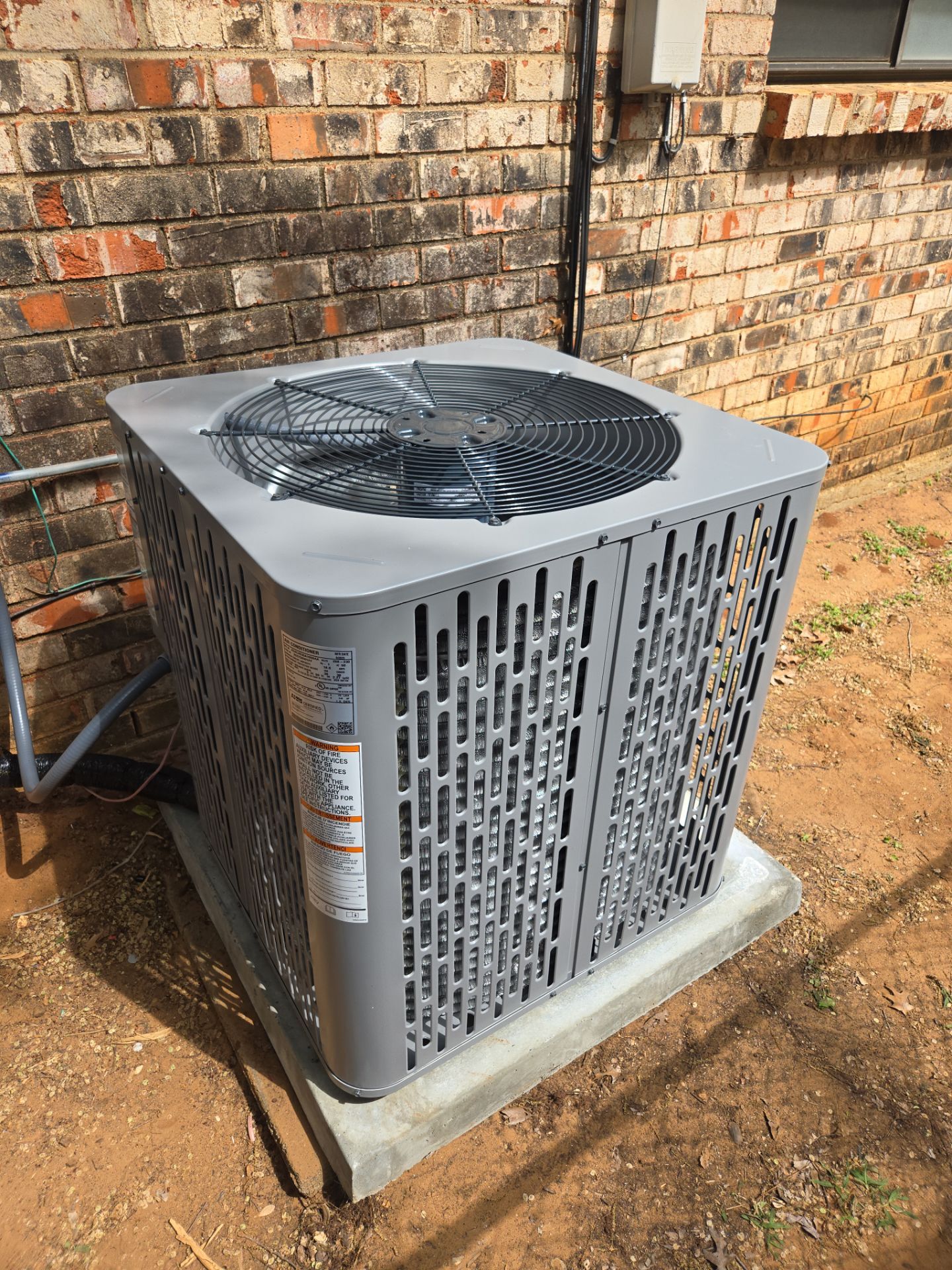 New American Standard outdoor AC condenser installed by Paschal in Arlington, TX