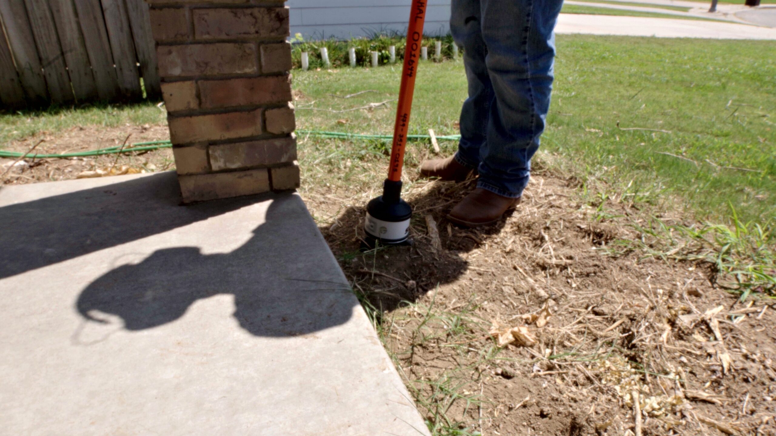 Acoustic ground sensor placed in the soil to pinpoint an underground water leak in Springdale