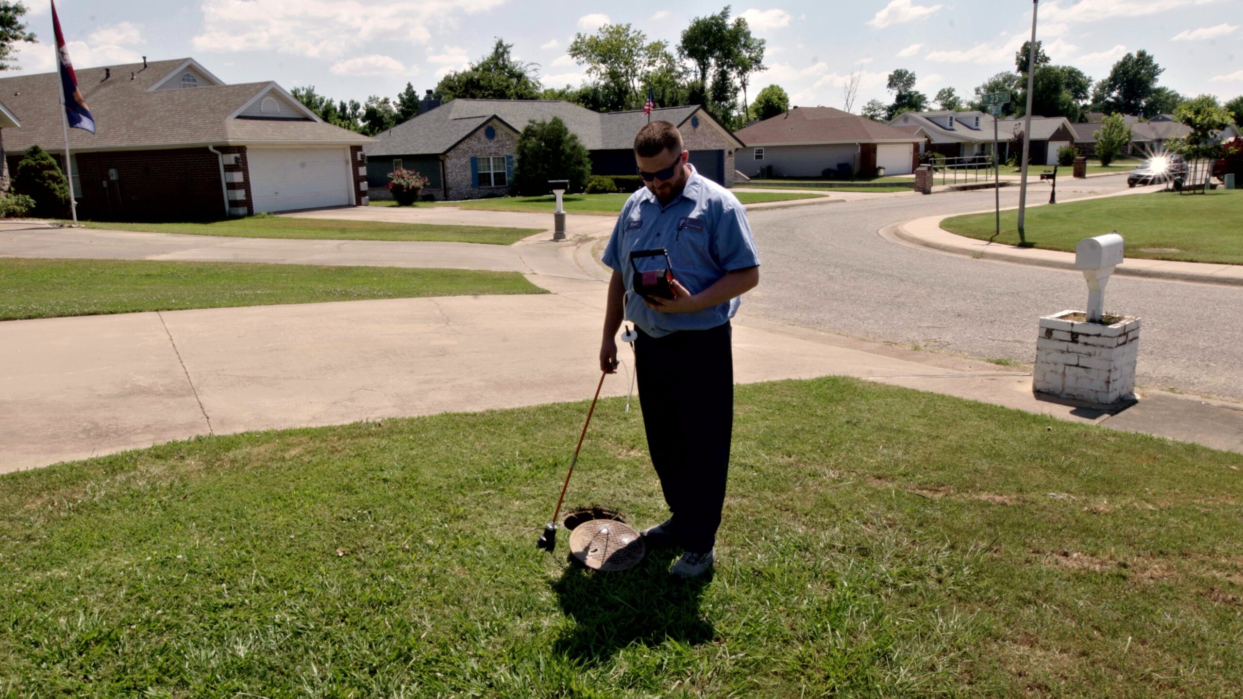 Paschal technician reviewing readings on a leak detection monitor to pinpoint a water leak in Springdale