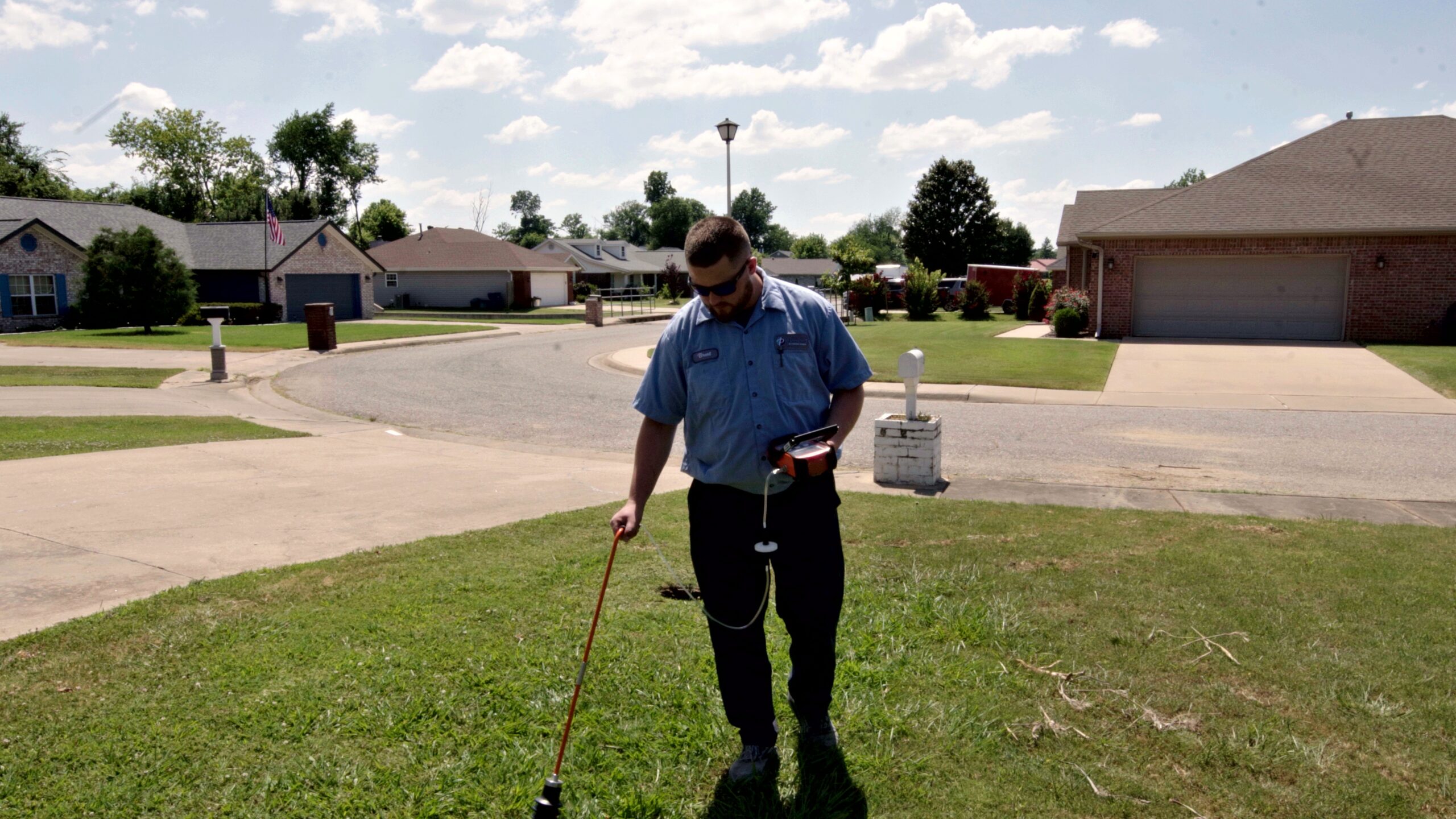 Paschal technician arriving with acoustic leak detection equipment at a Springdale home